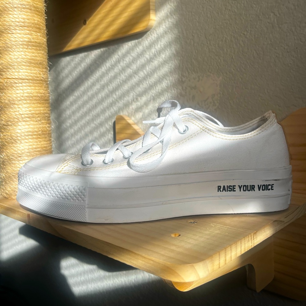 Low Top White Converse Chuck Taylor All Star trainers with lettering. Size 7.